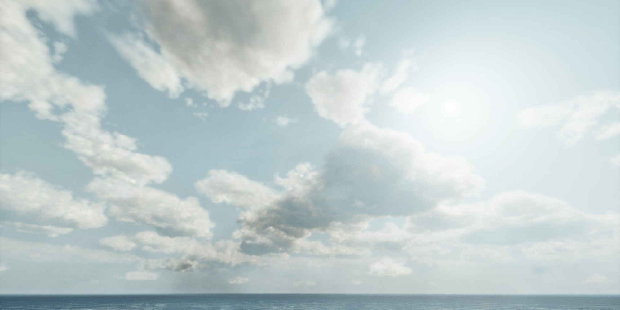 A bright view of realistic-looking, in-game clouds over a large body of water.