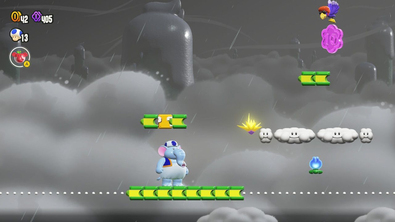 A 10-flower coin being held by a bird above a cloud platform.