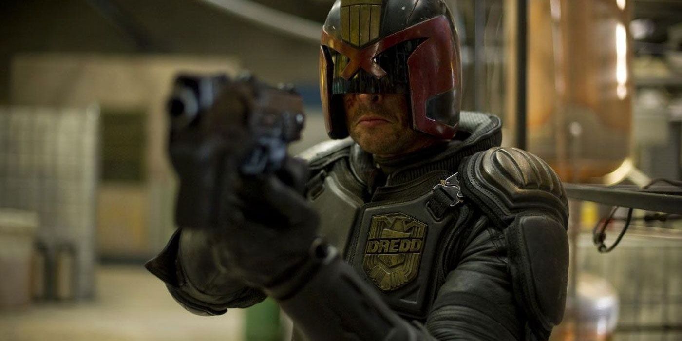 Karl Urban as Judge Dredd Holding Gun
