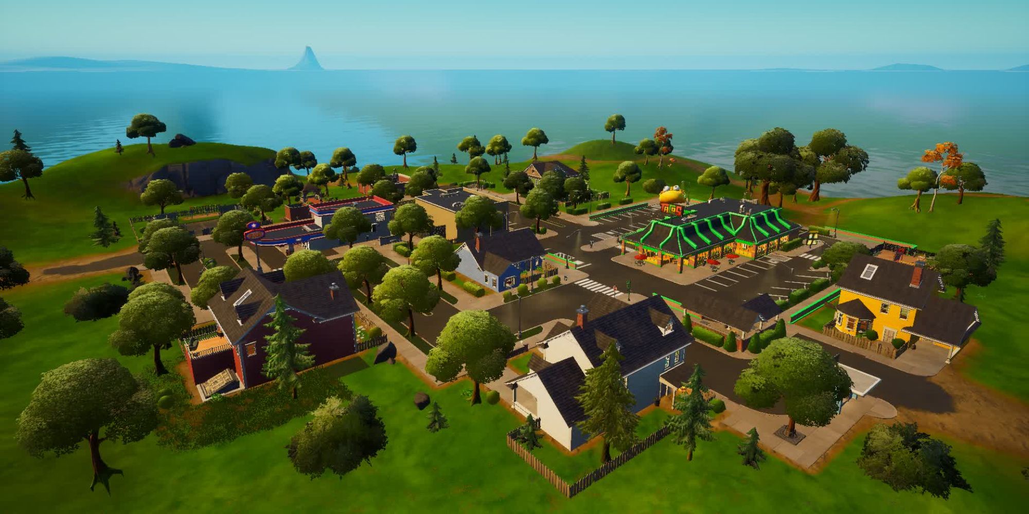 An image from Fortnite Chapter 4 Season 5 of the Greasy Grove POI, which is made out of a town and a fast food restaurant.