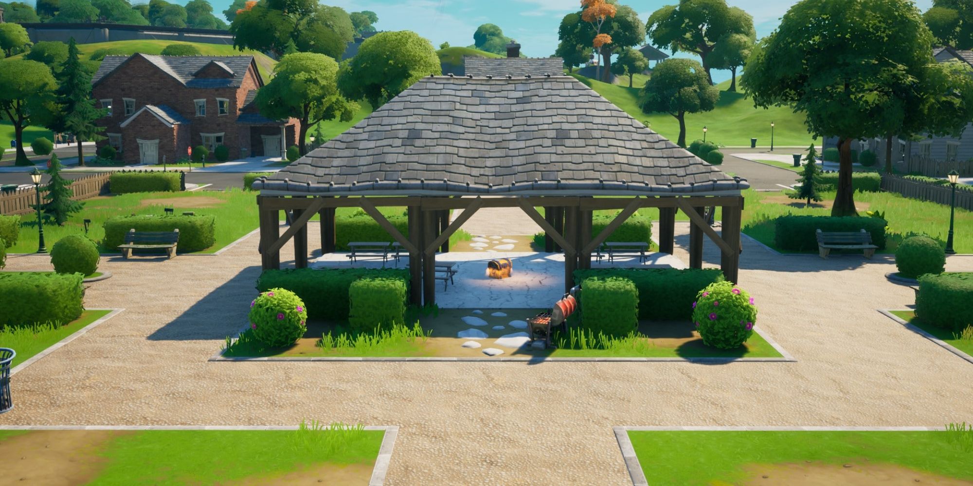 An image from Fortnite Chapter 4 Season 5 of the Pleasant Park POI, which is made up of a small park and suburban houses.