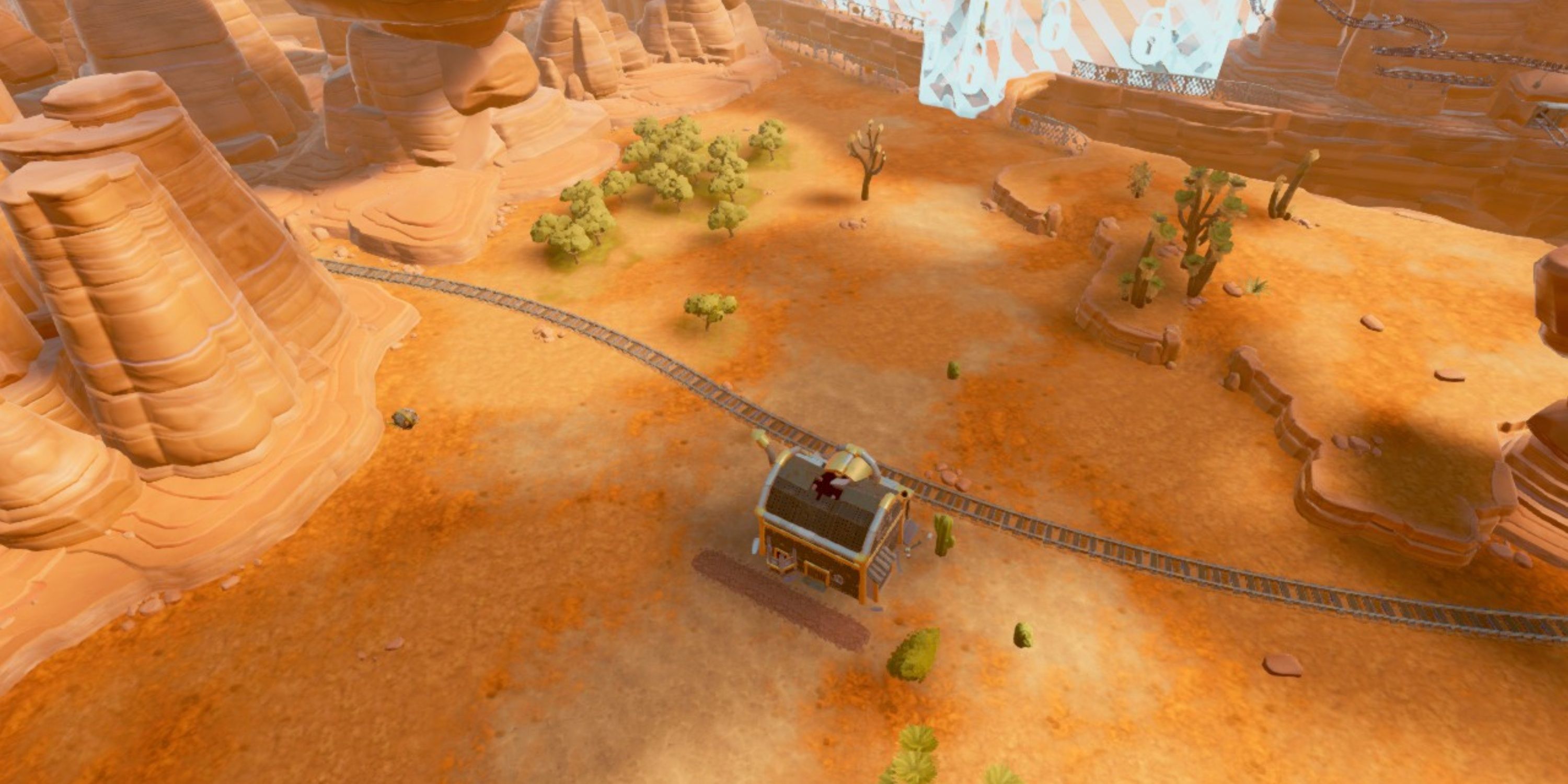Aerial view of the Grand Gully map, showing off its large mesa rock formations and the canyon that runs through the middle of it in Steamworld Build.