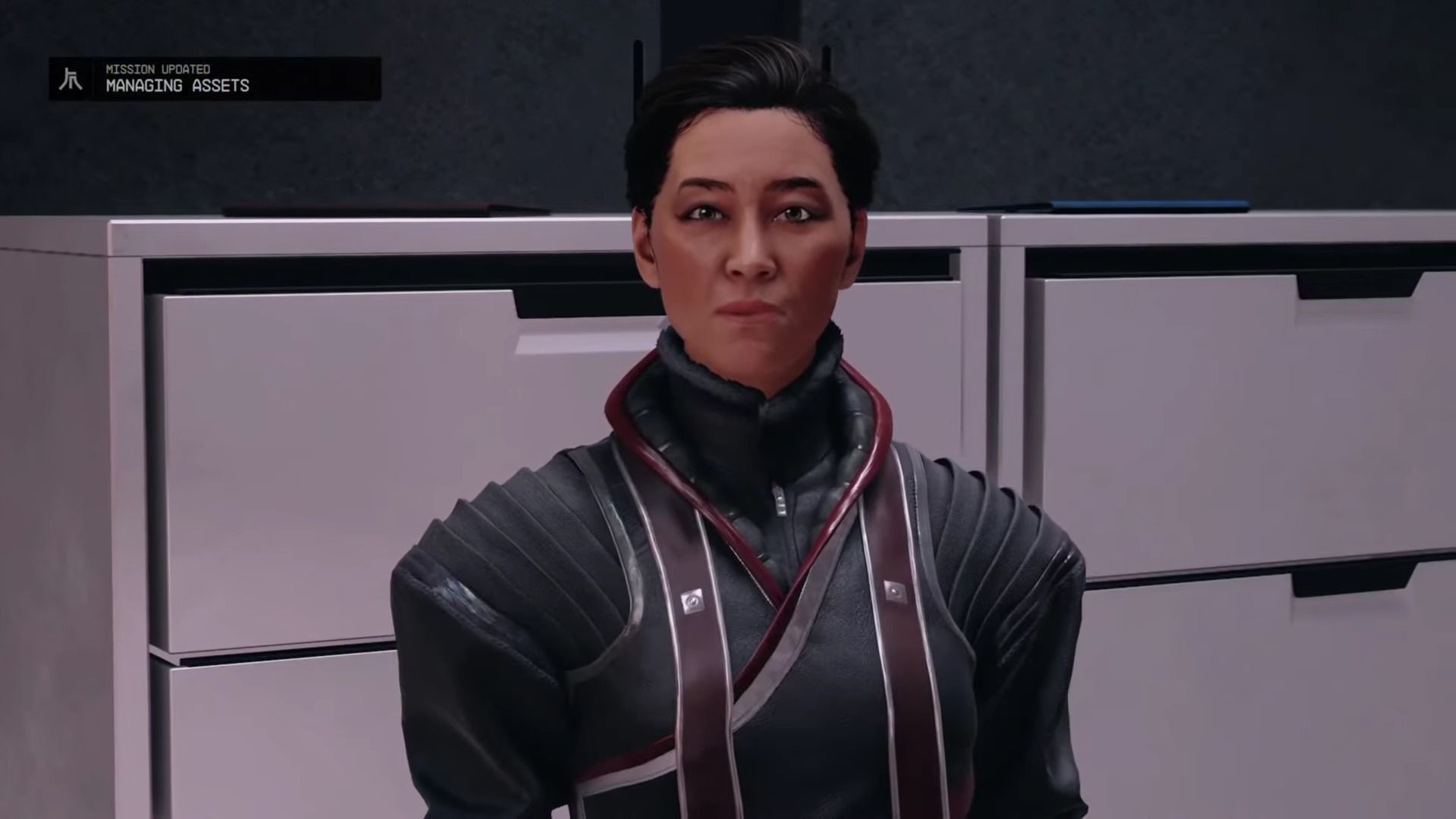 A player hearing the Managing Assets quest briefing from Masako in Starfield. 