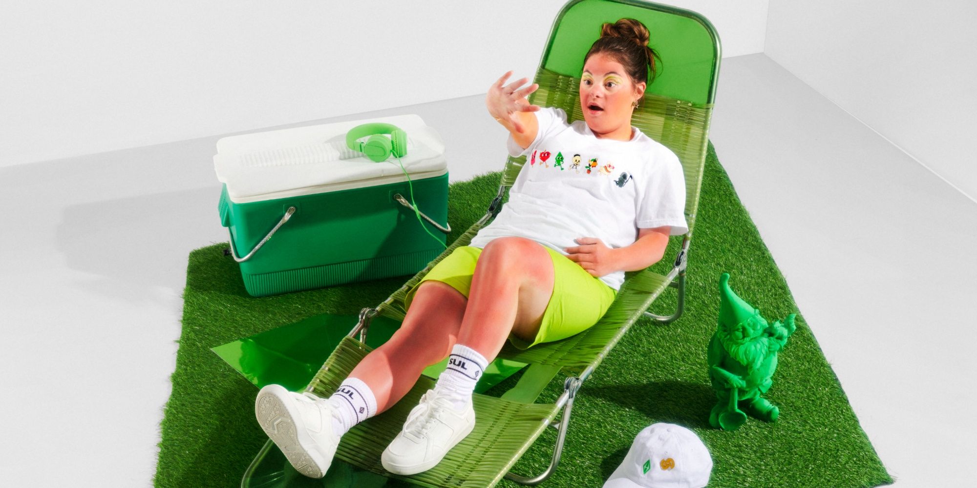 woman wearing sims merch on a sun lounger