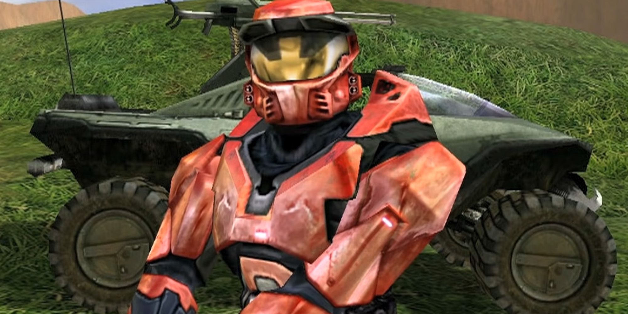A red Spartan from the Halo universe standing still with a jeep on their back.