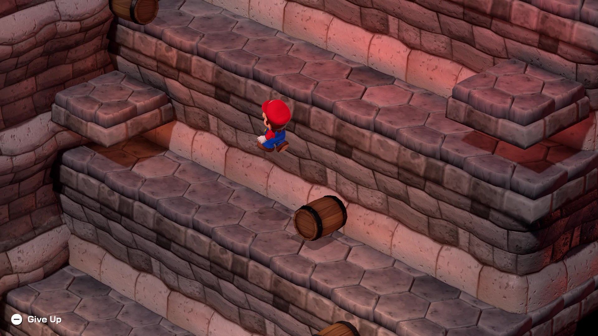 Mario jumping over a falling barrel in Super Mario RPG