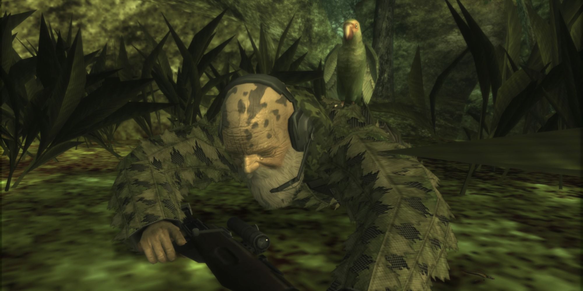 The End lying in the grass with a sniper rifle
