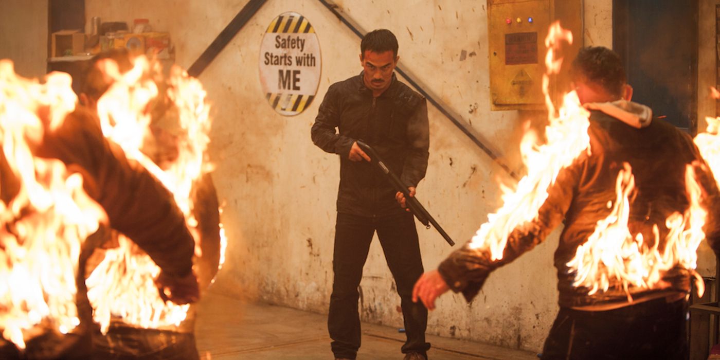 Joe Taslim as Ito Holding Incendiary Pump Shotgun