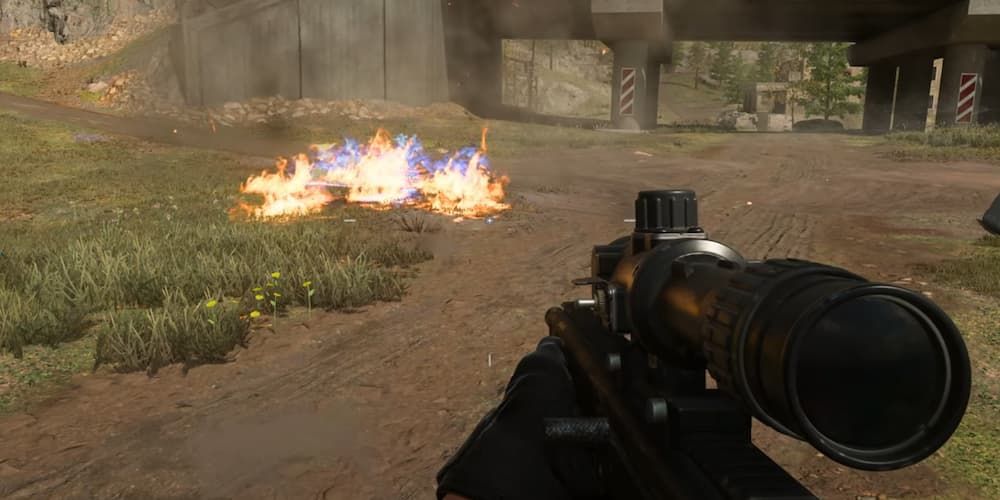 A Thermobaric Grenade goes off and creates a fire on the ground in Call of Duty: Modern Warfare 3.