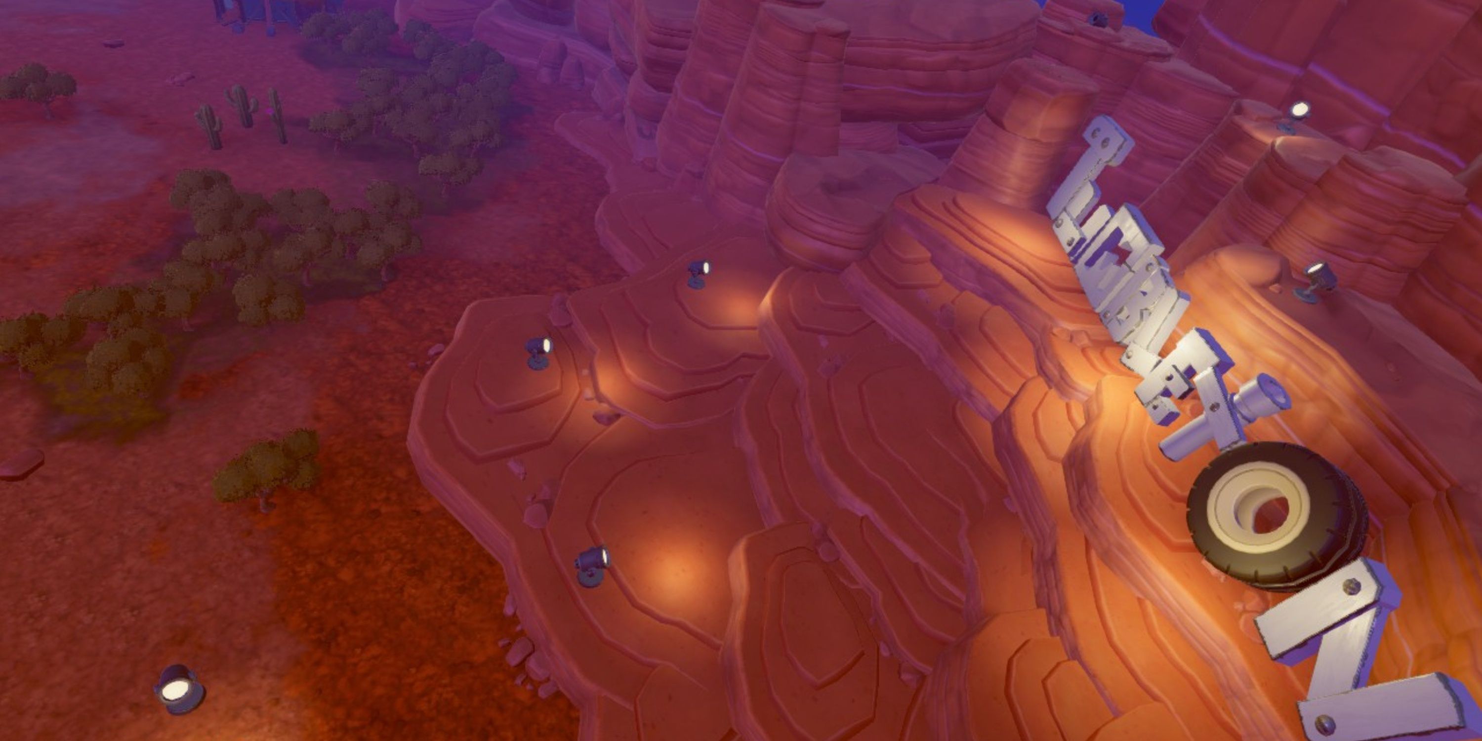 Aerial view of the Tumbleton map, showing off its small forests, nighttime atmosphere, and its large, brightly lit Tumbleton sign in Steamworld Build.