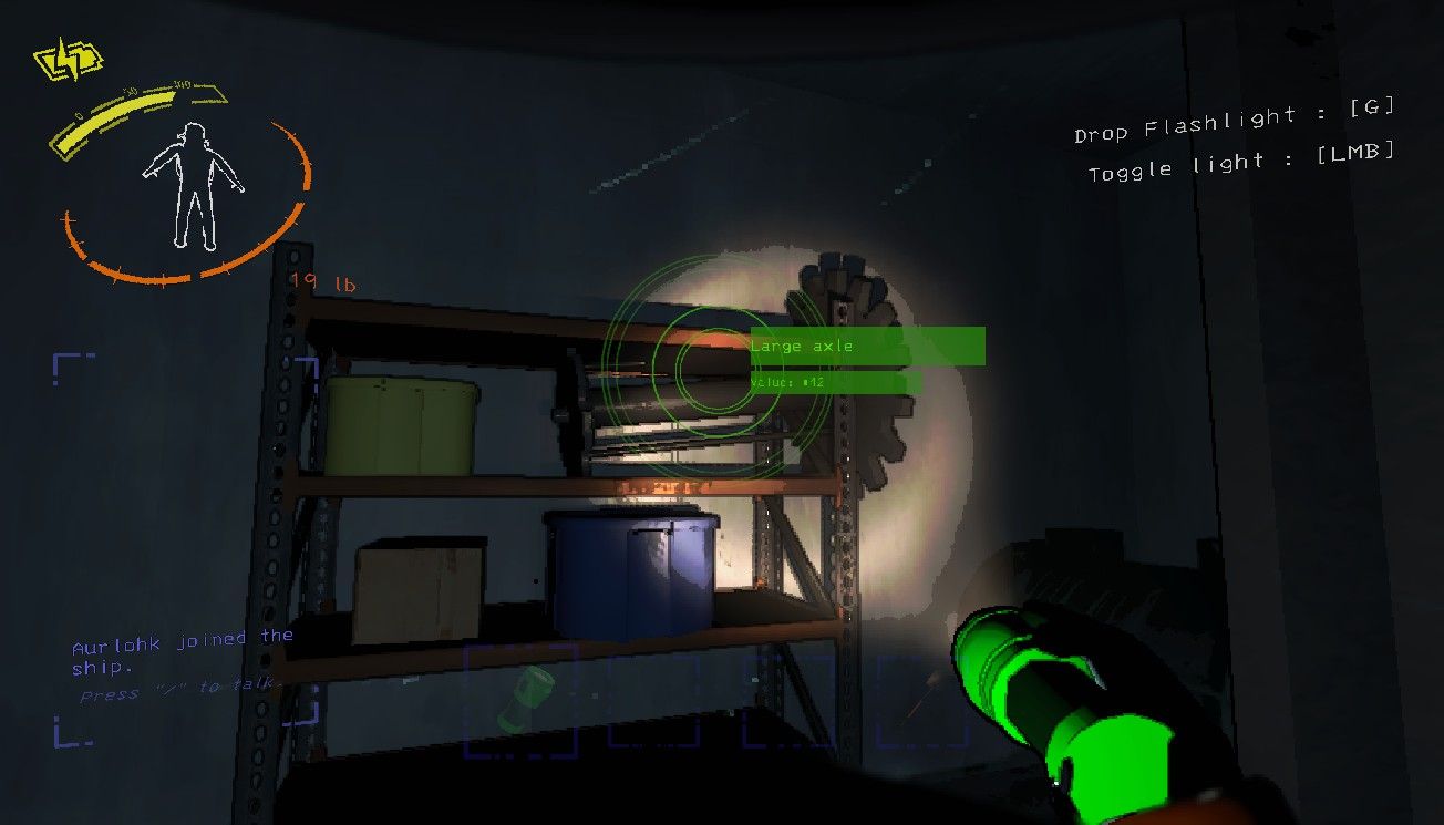 Player character shining a flashlight on a large axle sitting on a metal shelf in a complex in Lethal Company.