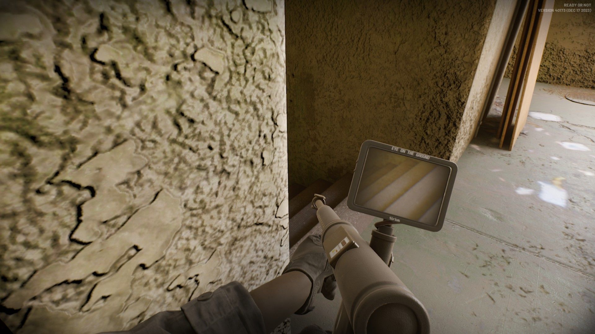 Peeking around a corner with the mirrorgun in Ready or Not