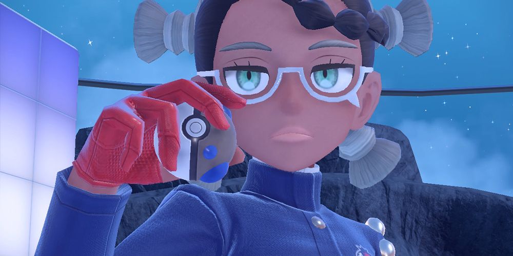Amarys holding a Heavy Ball to her face, looking at the trainer before releasing her Pokemon in her BB League Elite Four Battle in Pokemon Scarlet & Violet The Indigo Disk.