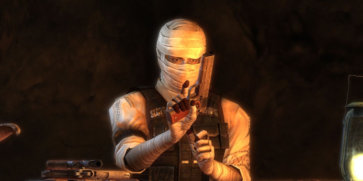 Image of Joshua Graham/Burning Man from New Vegas reloading pistols