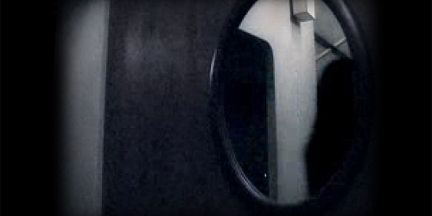 Shadowy Figure Reflected in Mirror