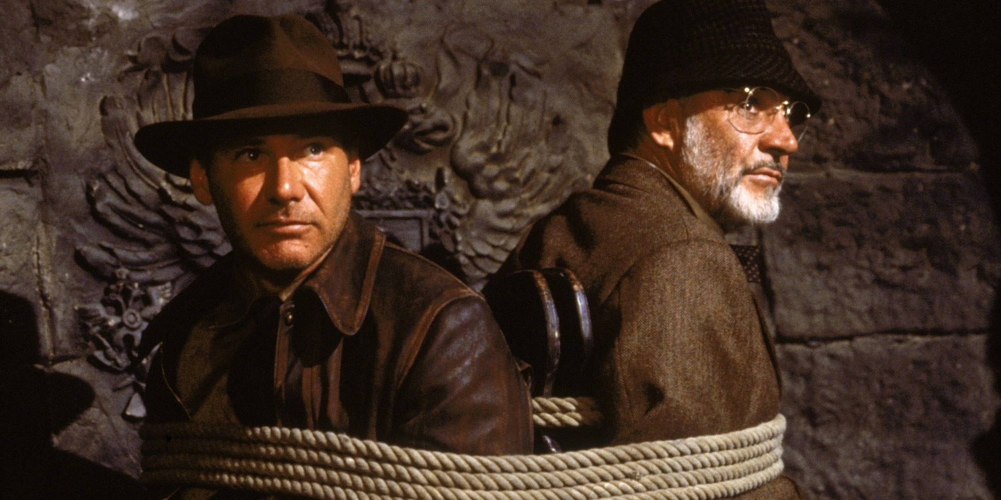 Harrison Ford and Sean Connery tied to a chair in Indiana Jones and the Last Crusade