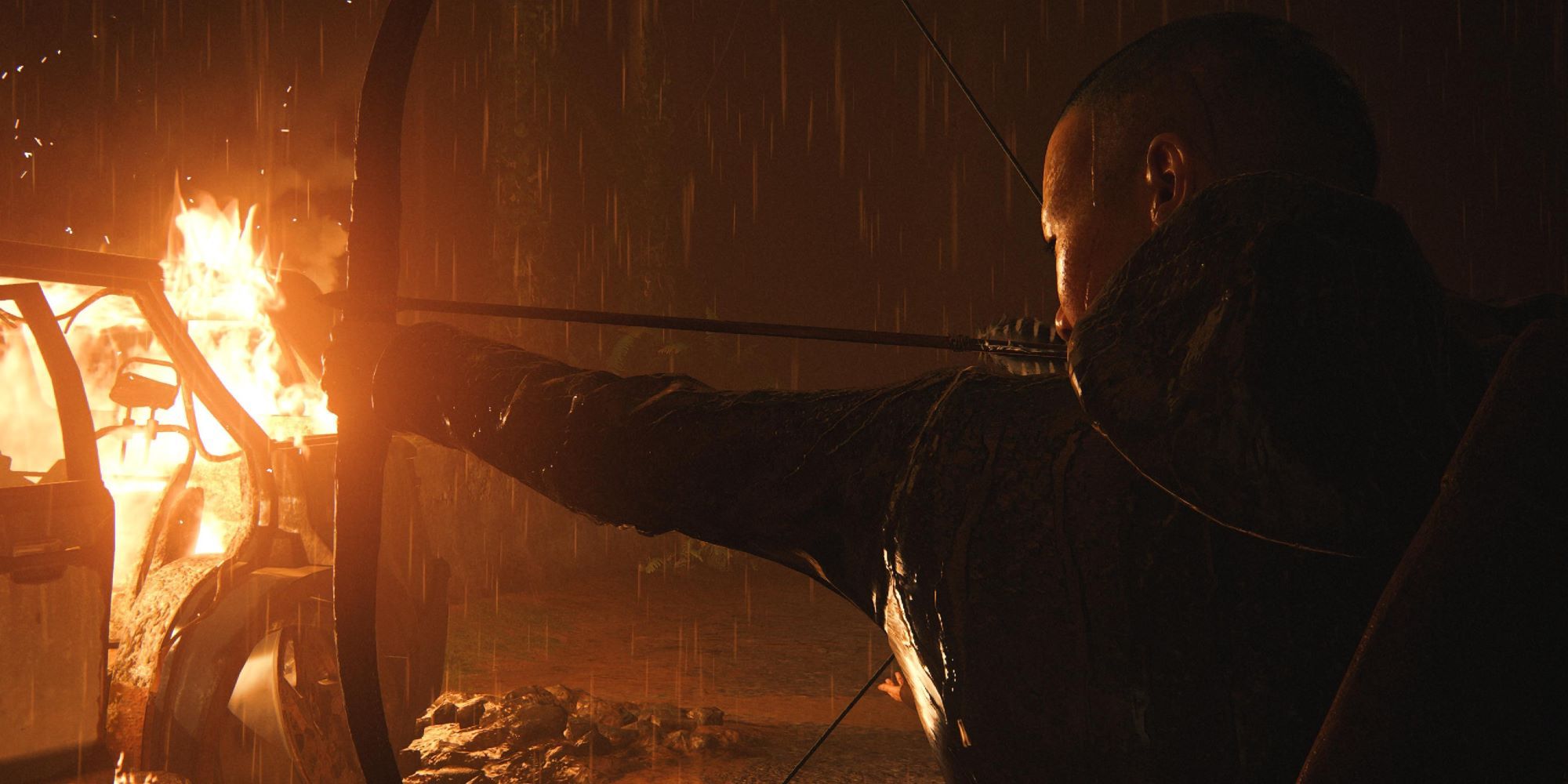 Lev aiming a bow surrounded by fire in The Last of Us Part 2