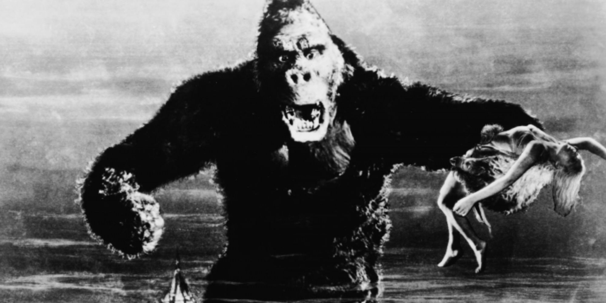 King Kong from the original movie, clutching his captive atop a skyscraper.