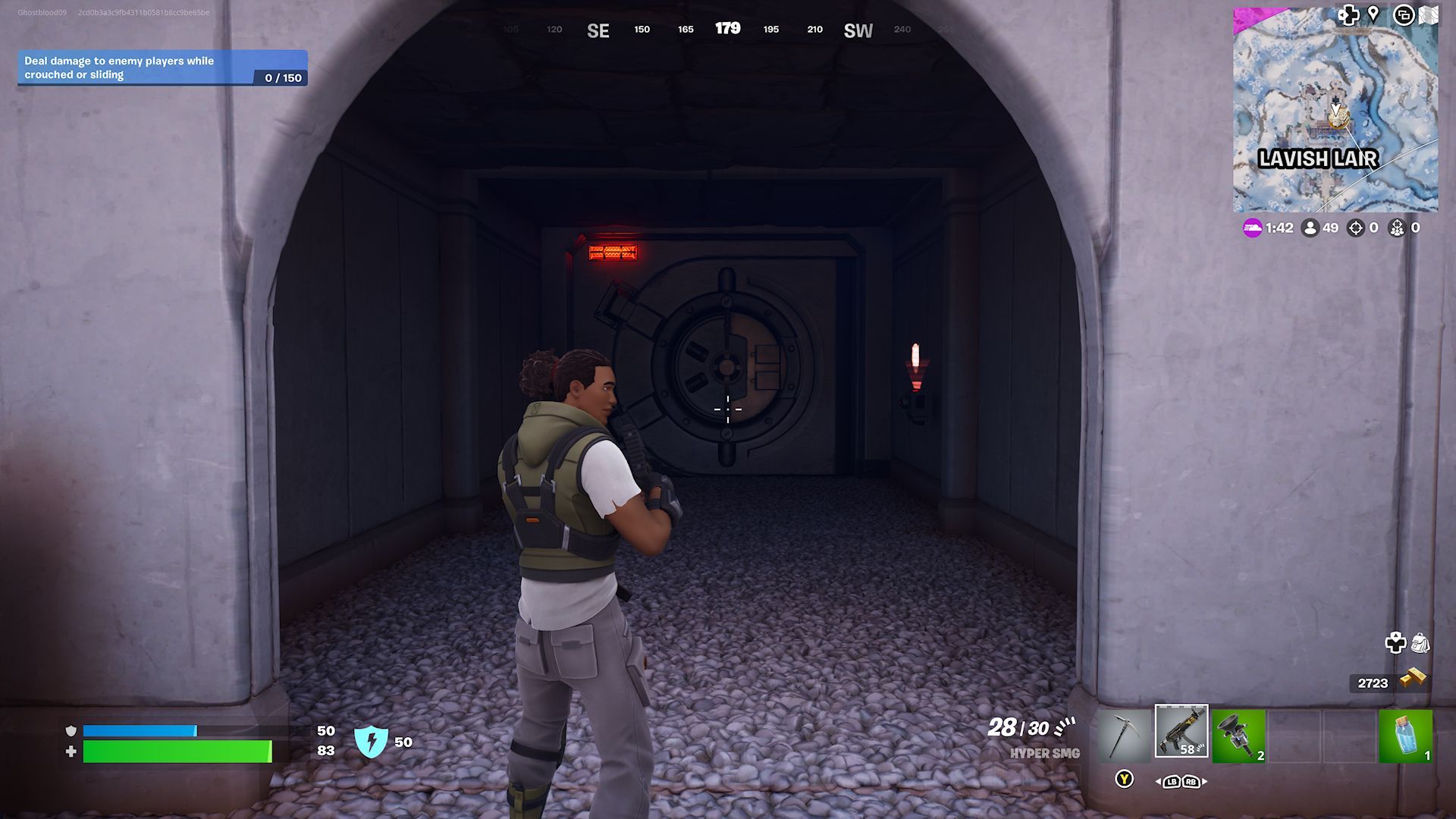 A player standing in front of a vault hidden under an arch at Lavish Lair in Fortnite.
