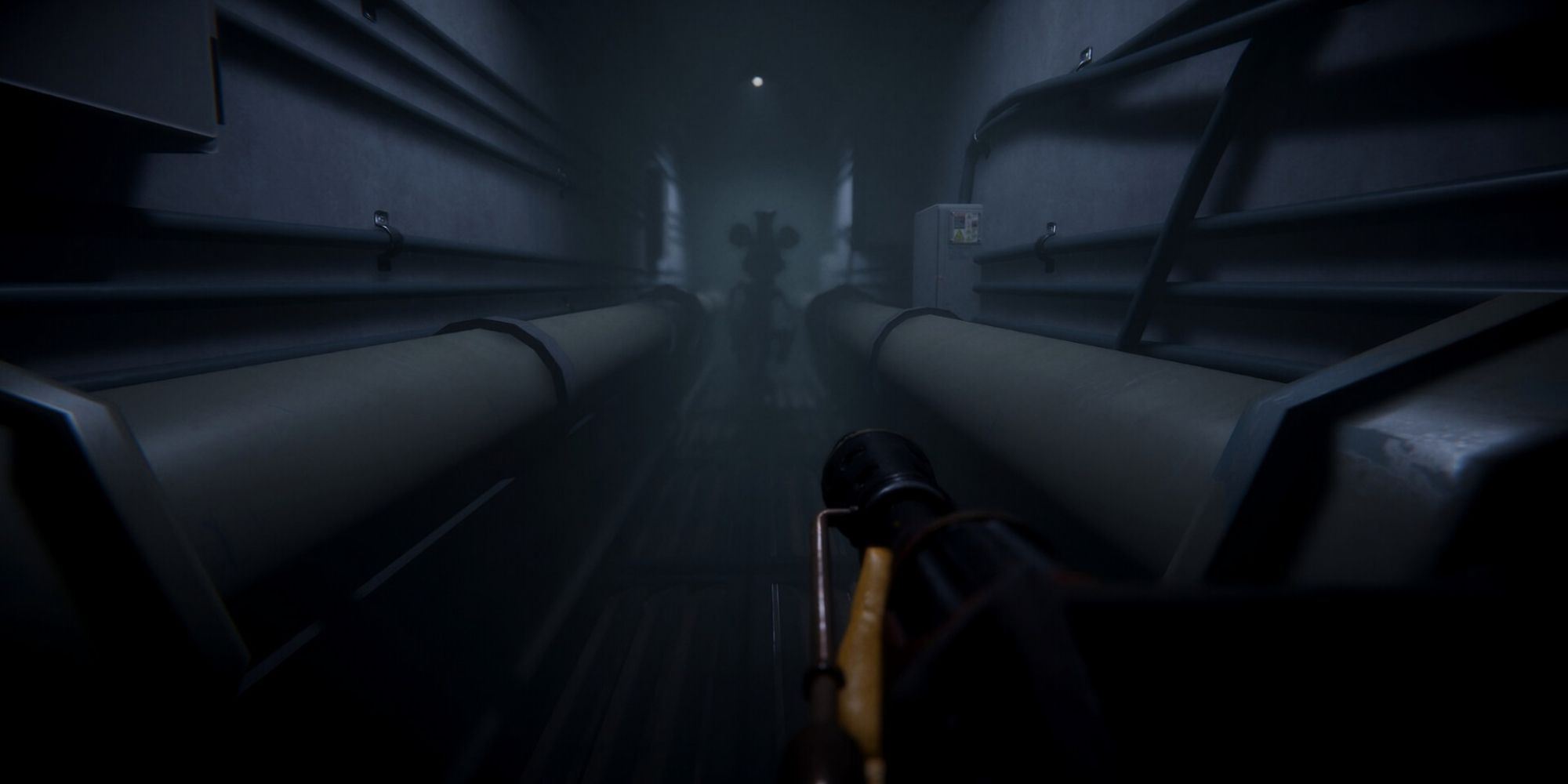 A player aiming a weapon at a shadowy figure of Steamboat Willie in the distance