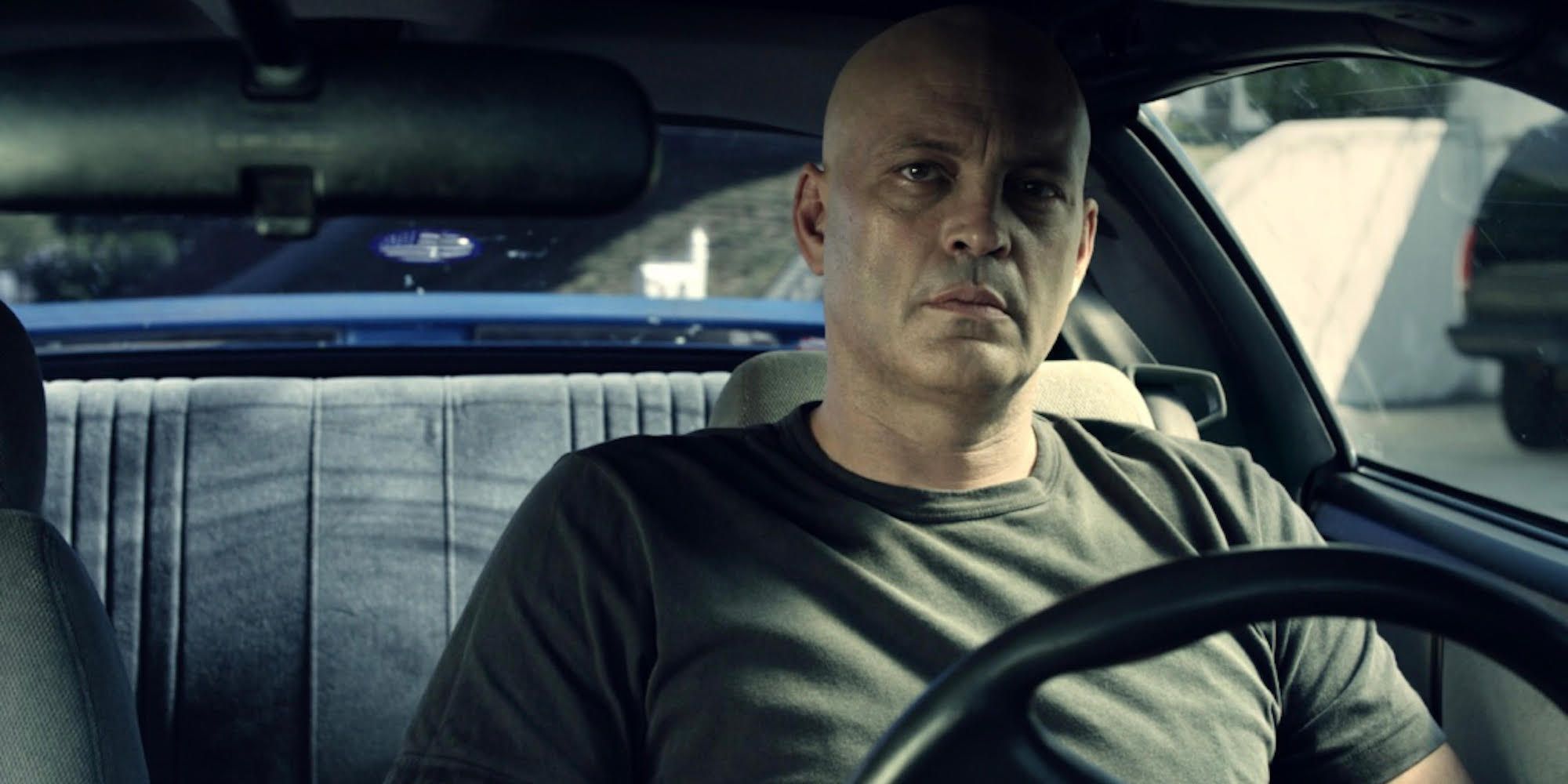 Vince Vaughn sitting in a car behind the wheel