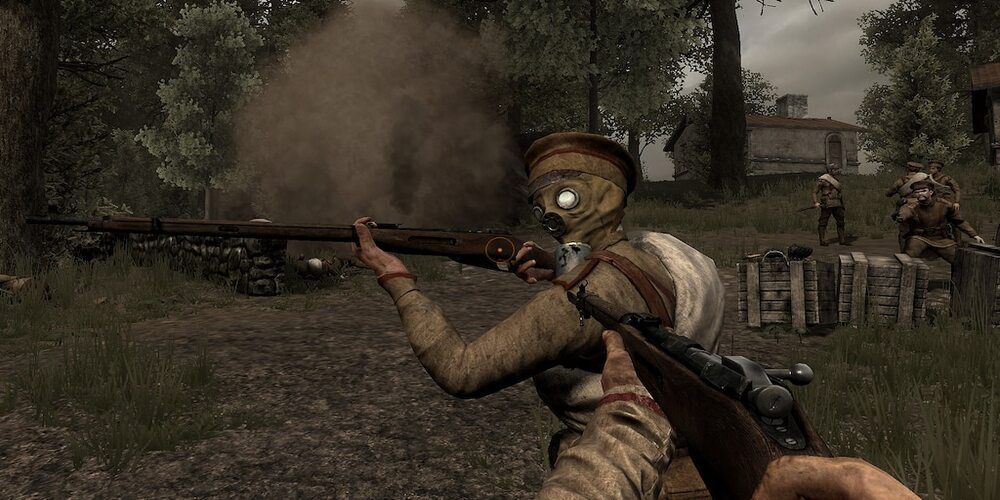 A screenshot of the player character looking at a partner holding a rifle and wearing a mask.