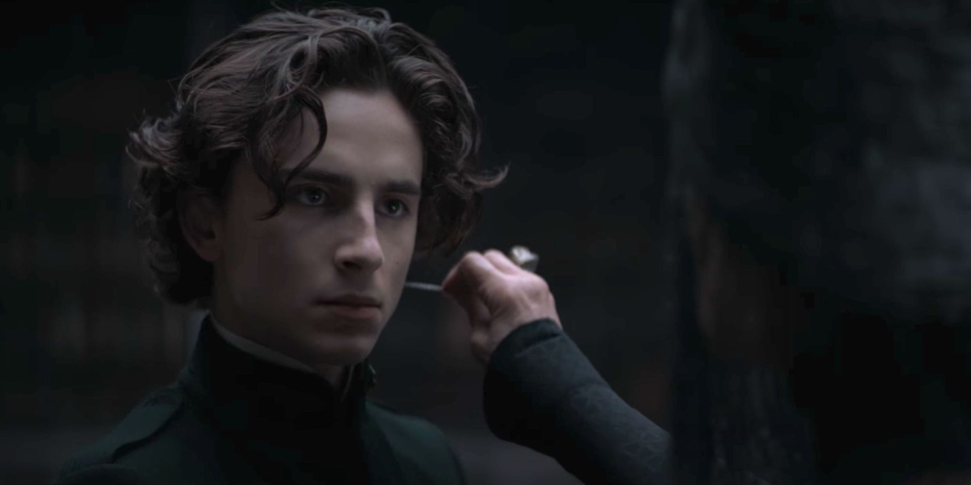 Reverend Mother Gaius Helem Mohiam (Charlotte Rampling) administers the gom jabbar test to Paul Atreides (Timothee Chalamet) in Dune (2021)