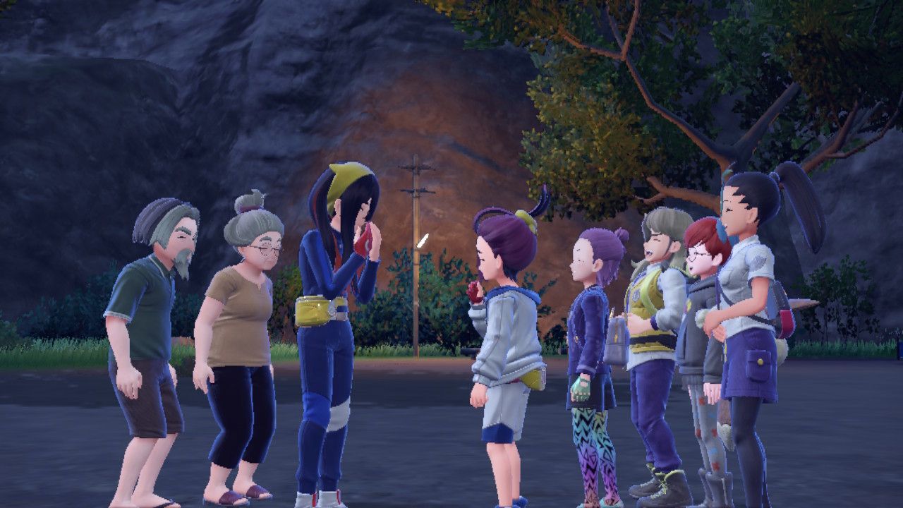 All your friends stand around you after you lift Pecharunt's curse on Mossui Town.