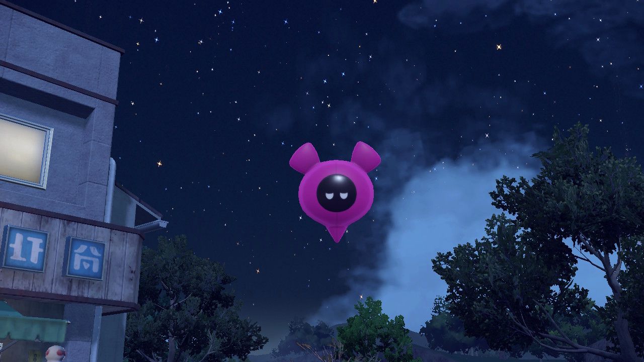 The purple plush-like Pecharunt floating in the air.