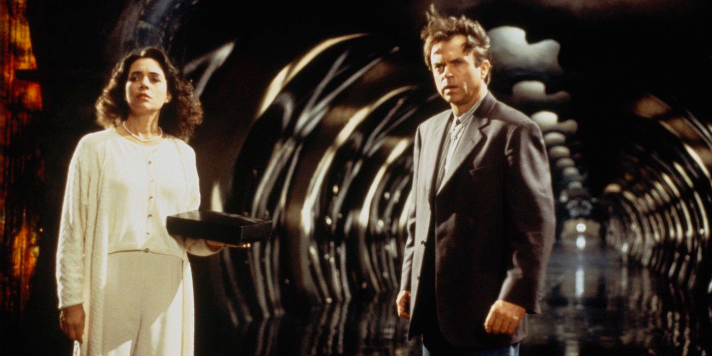 Sam Neill Standing Next To Julie Carmen