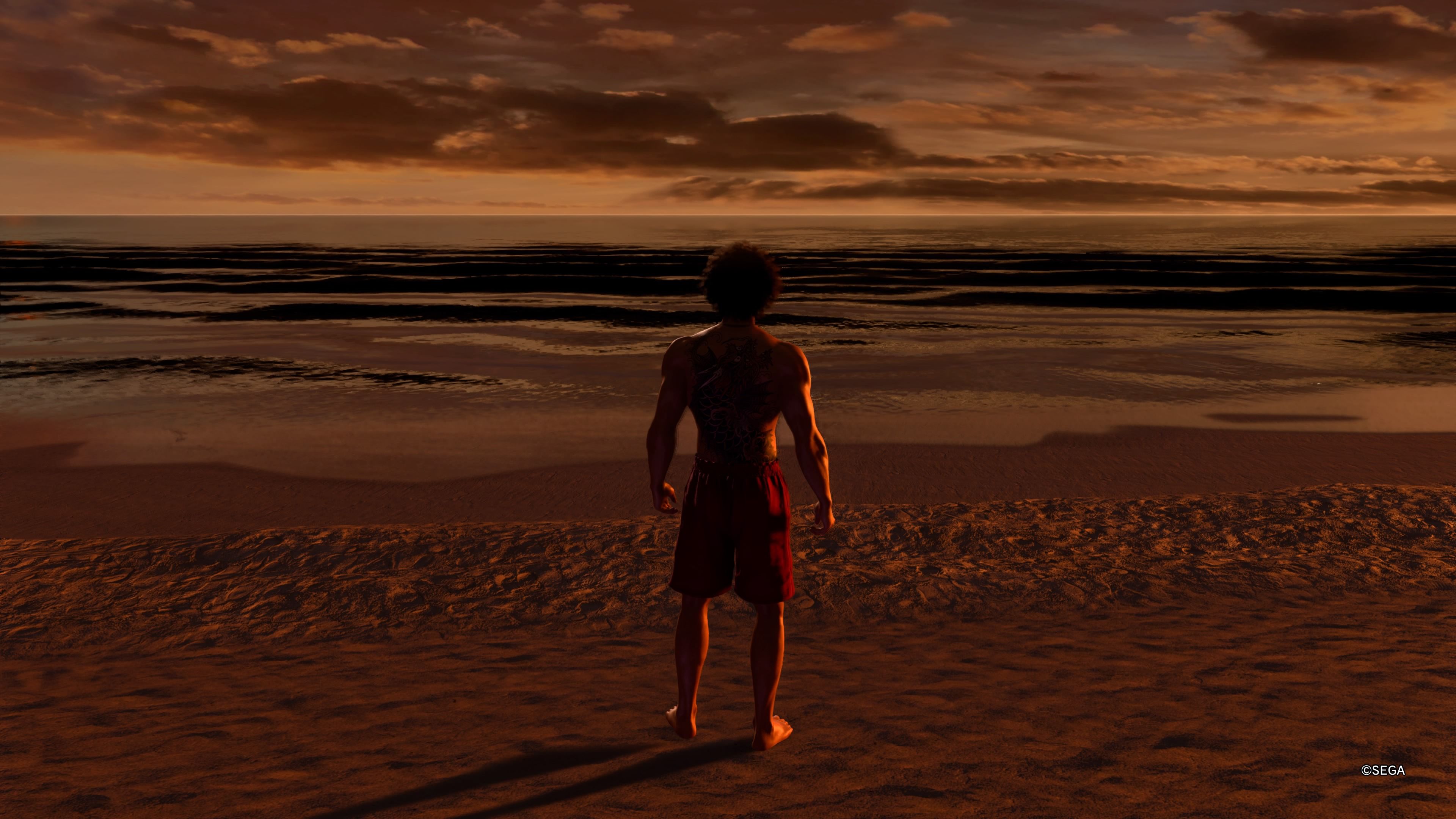 Kasuga standing on the beach at sunset in Like a Dragon Infinite Wealth.