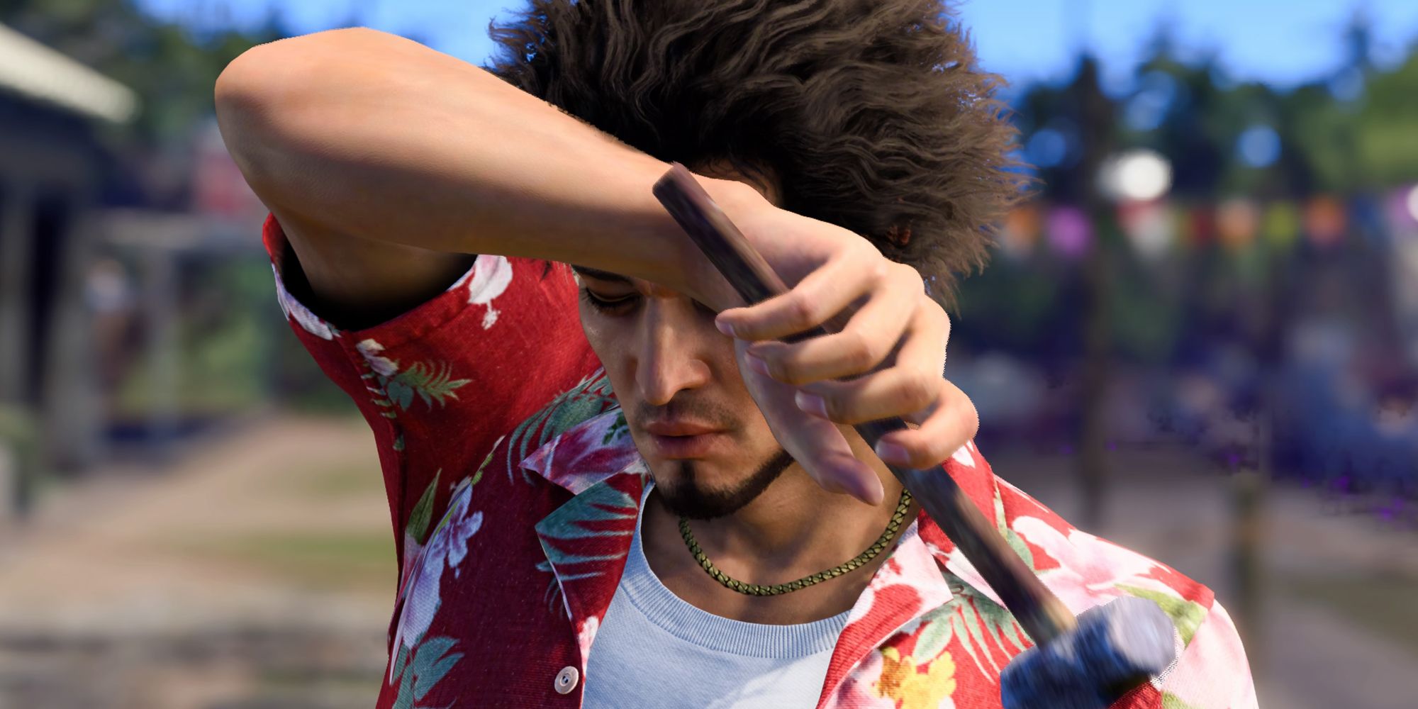 Kasuga wiping his forehead while holding a hammer in Like a Dragon Infinite Wealth.