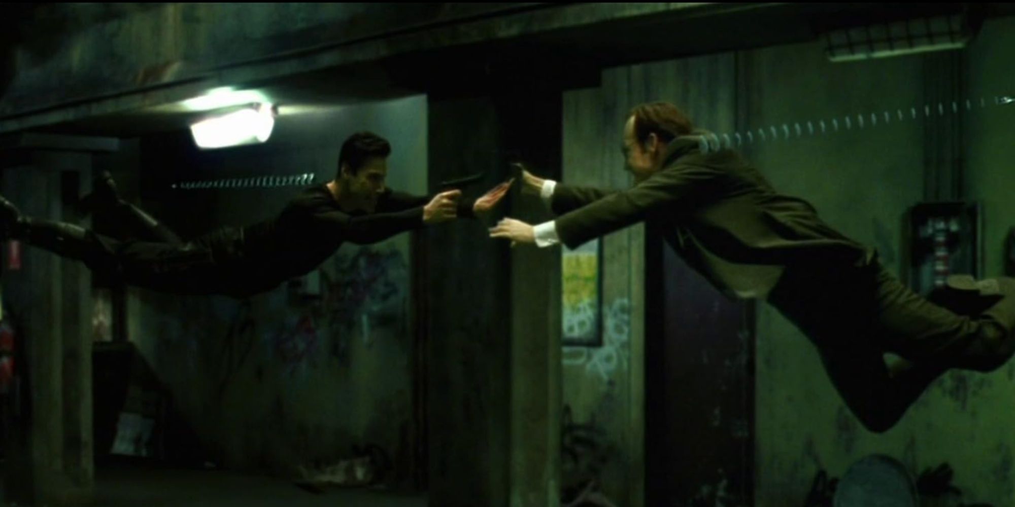 The iconic fight scene from The Matrix where Neo and Agent Smith are suspended in the air dodging each other's fired round.