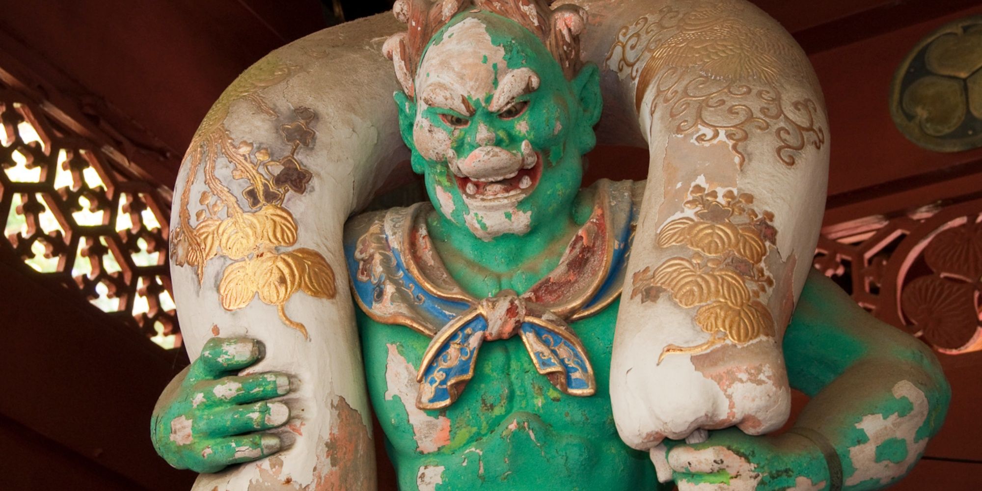A statue of Fujin, Japanese wind god, at Taiyū-in in Nikkō.