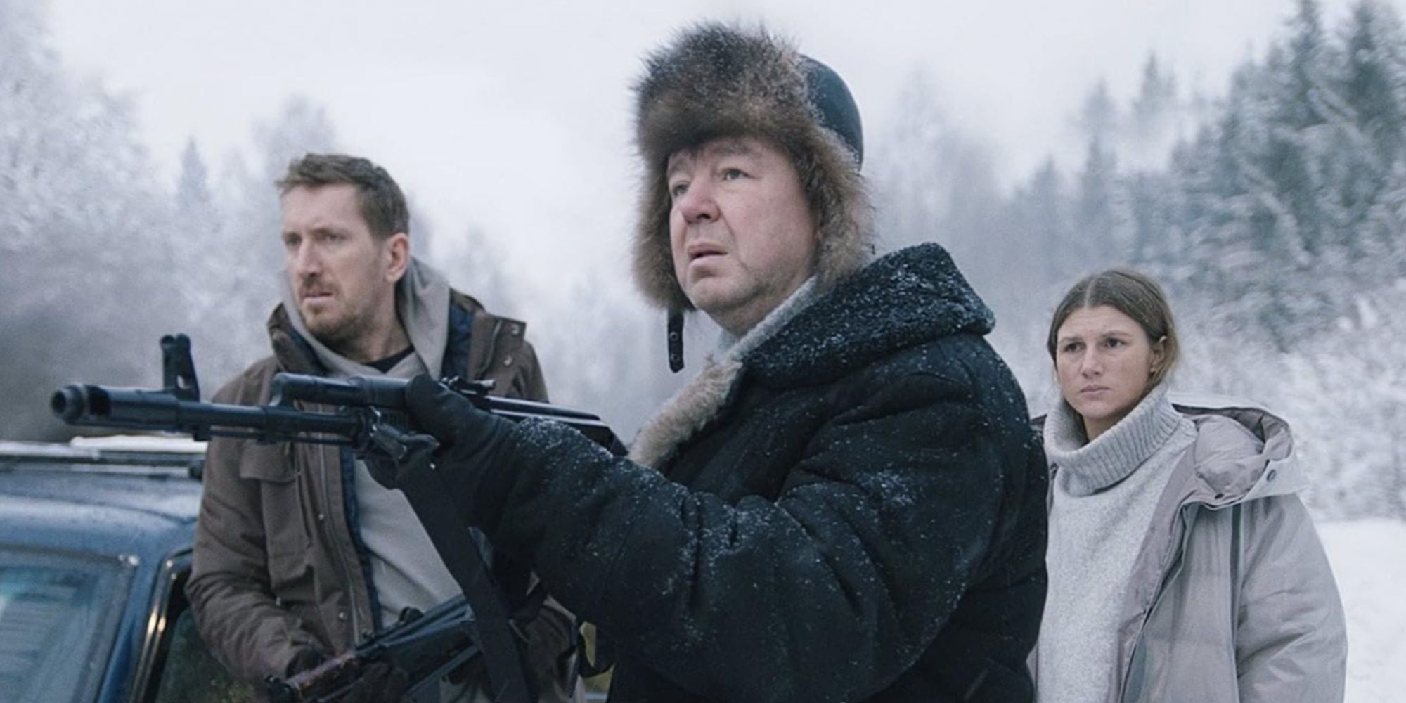 Lyonya standing in front of Sergey and Irina pointing an AK-47 rifle at someone off-screen.