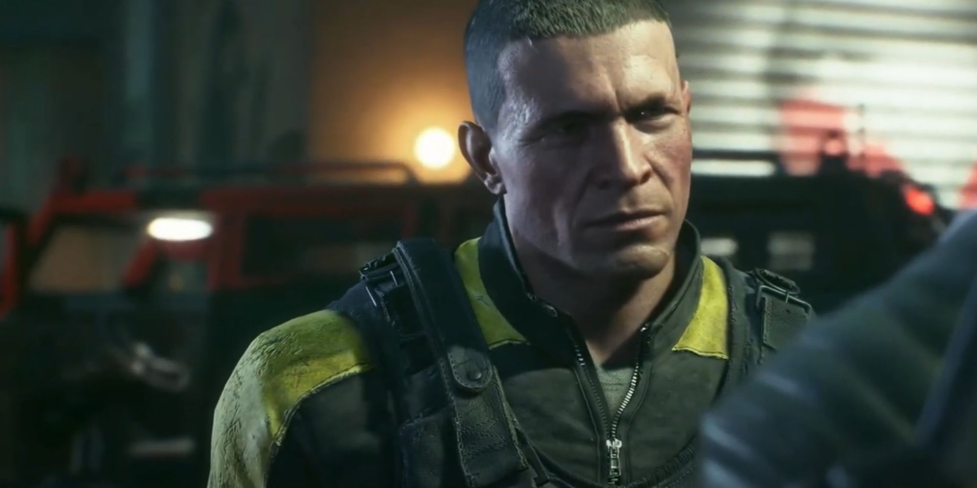 Close-up of Rick Flag and his constantly stern face looking at Deadshot and correcting his rank.