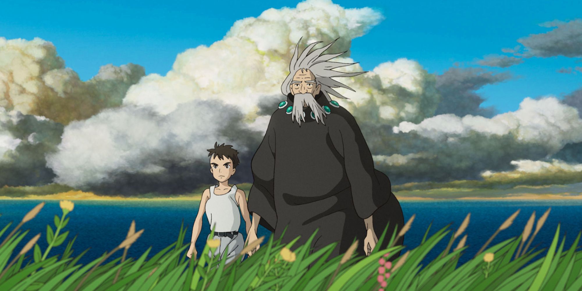 Mahito and Grand Uncle walk through a field of grass next to an endless ocean.