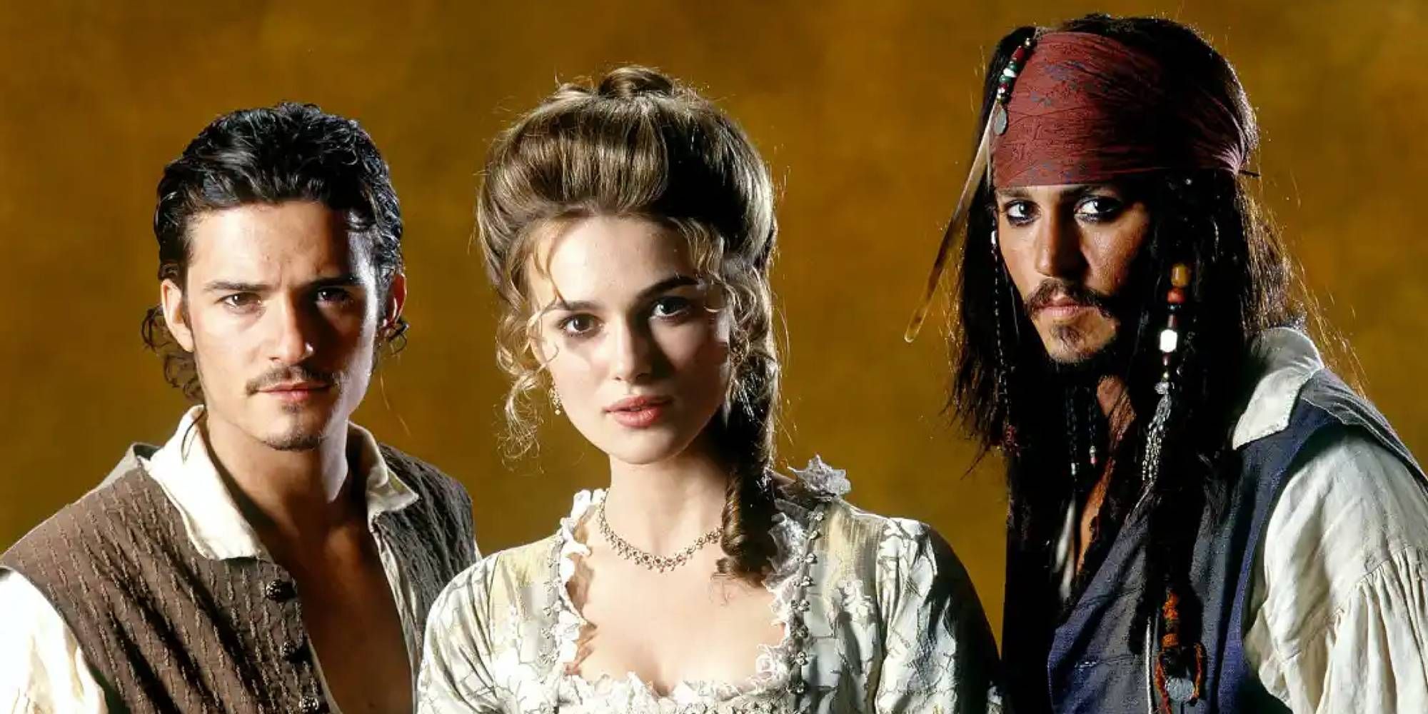 William Turner, Elizabeth Swann and Johnny Depp stand together in Pirates Of The Carribean costumes