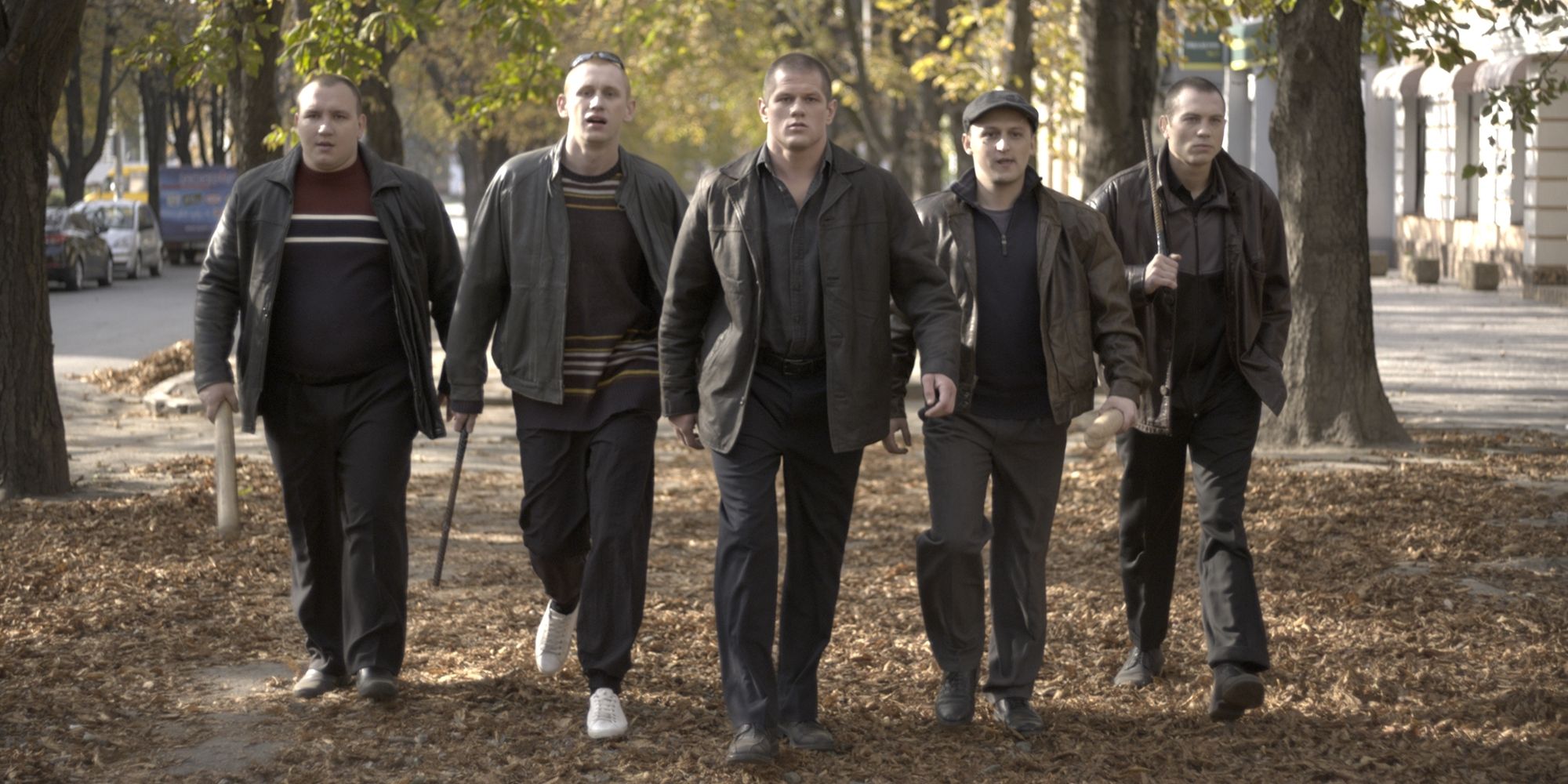 Characters walking toward the camera with melee weapon in hand