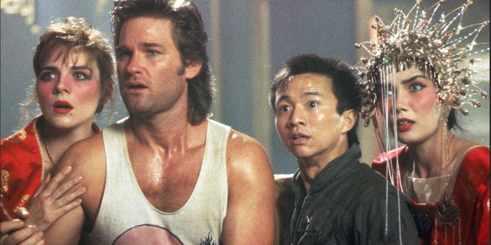 Jack Burton holds a spear, Wang Chi, Gracie Law, and Miao Yin behind him. 