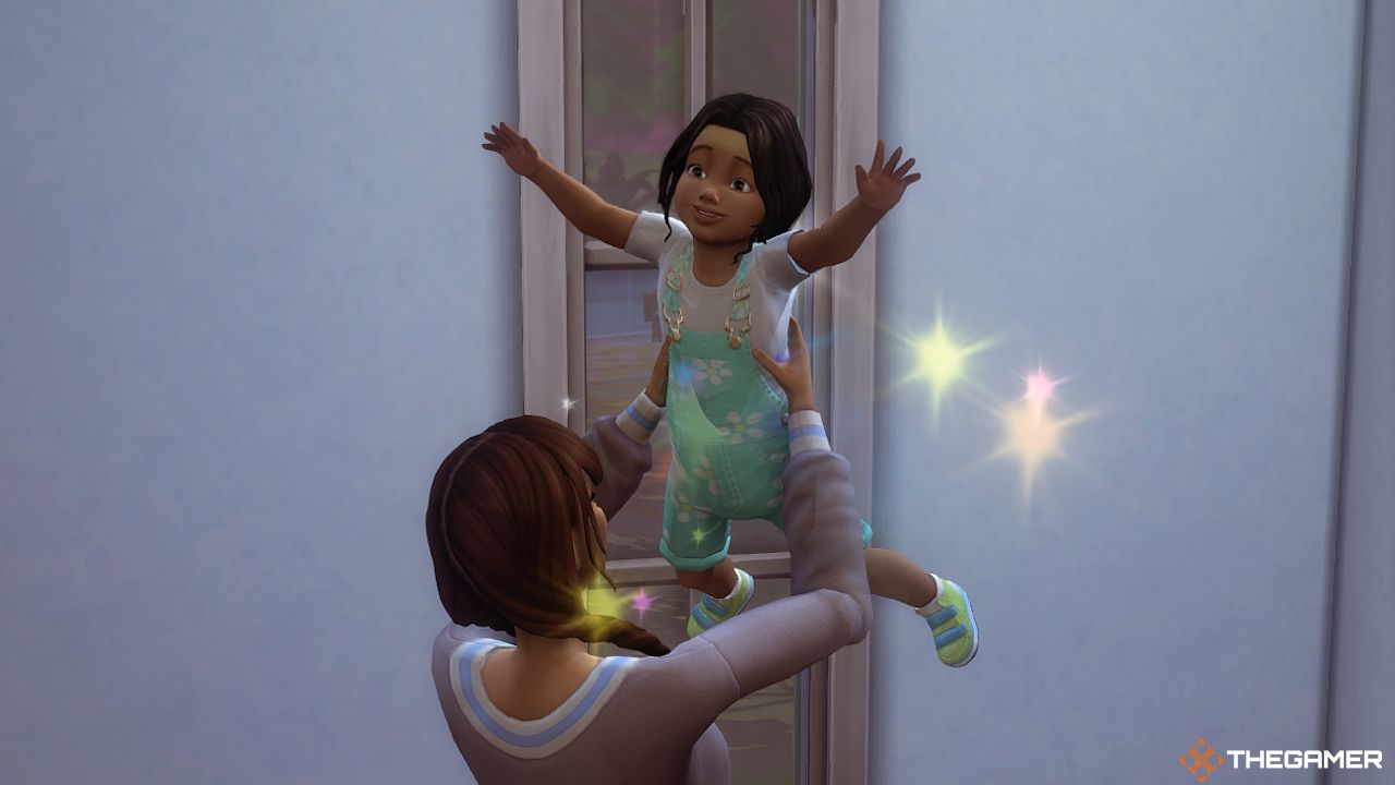 A toddler Sim being spun during the Zodiac Challenge