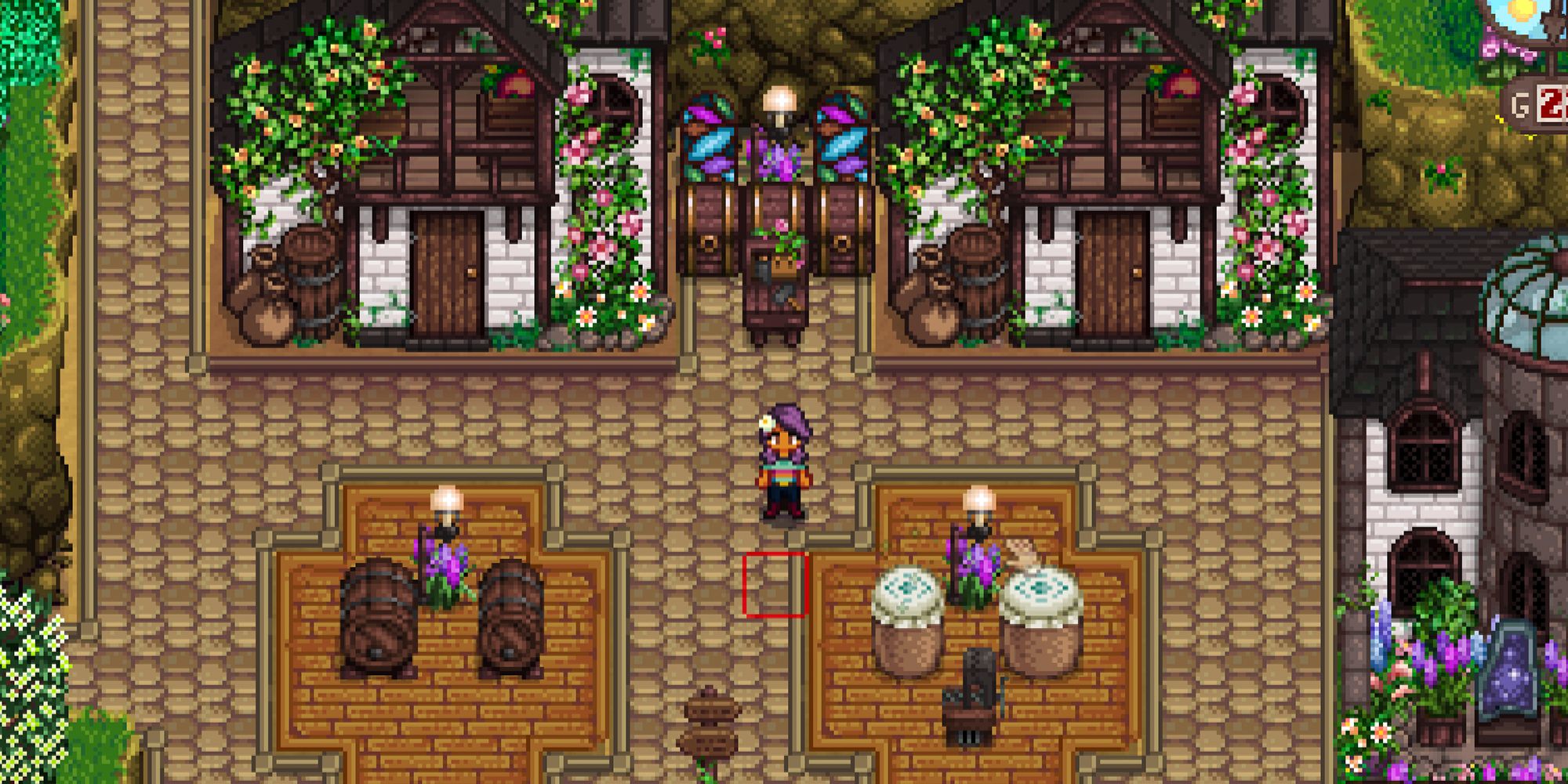 Stardew Valley farmer standing beside their house. There is a shed with two kegs in front of it and a shed with two preserve jars in front of it.