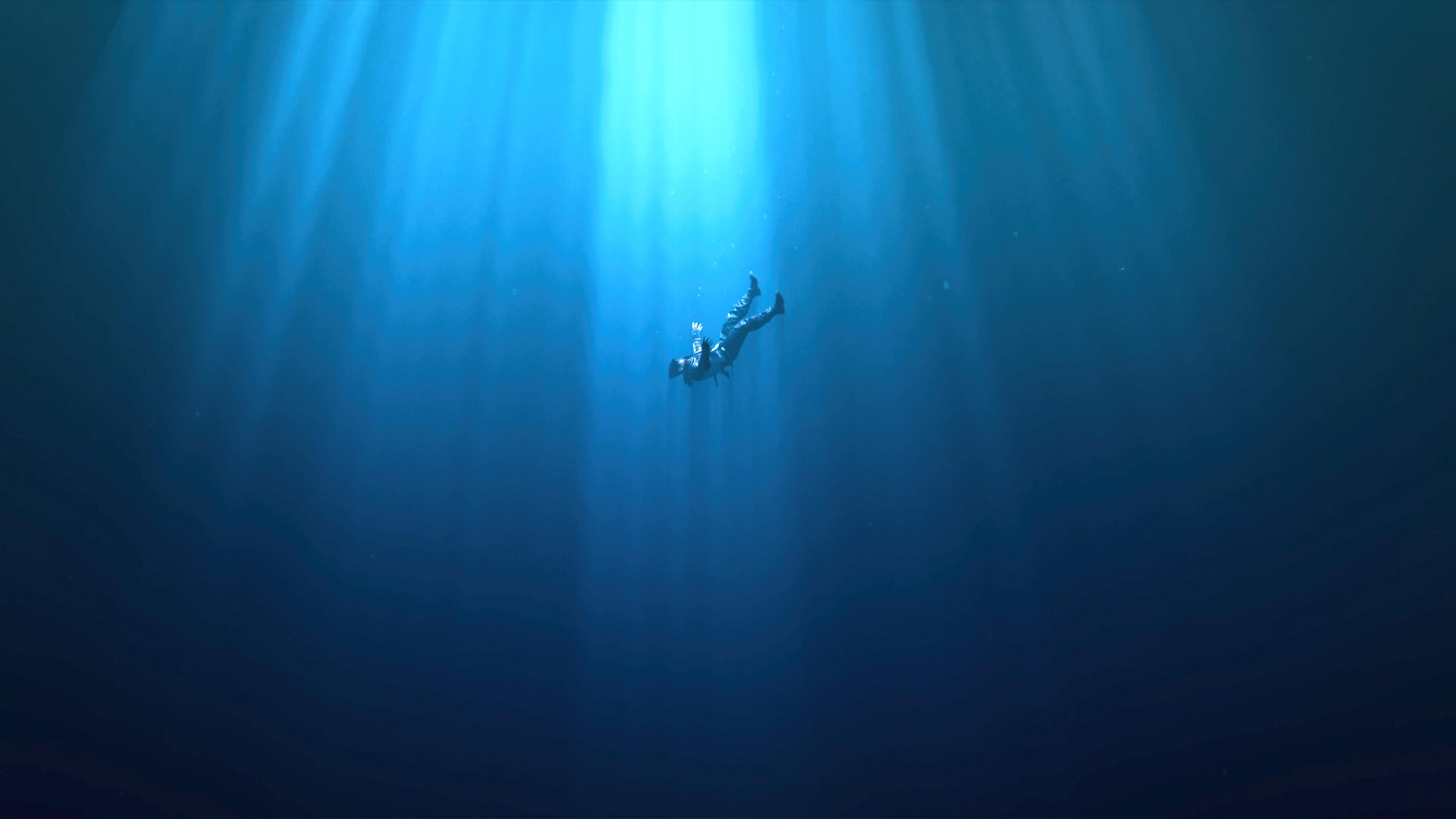 Jin Kazuya falling deep into an ocean.