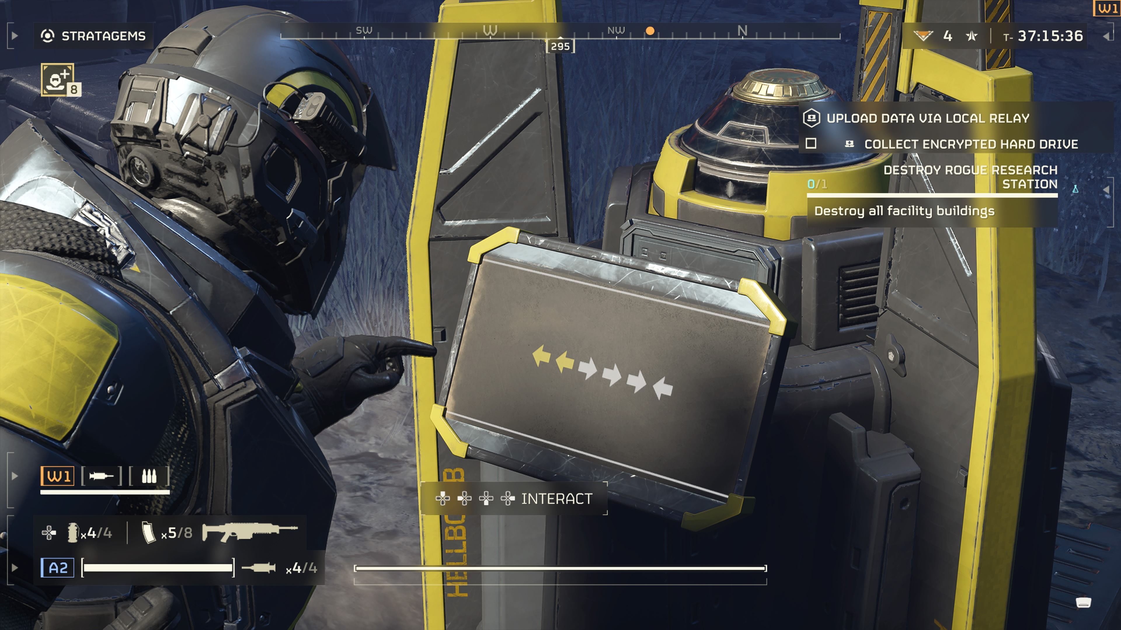 Player character interacting with a Hellbomb's terminal and arming it using a sequence of inputs in Helldiver 2.