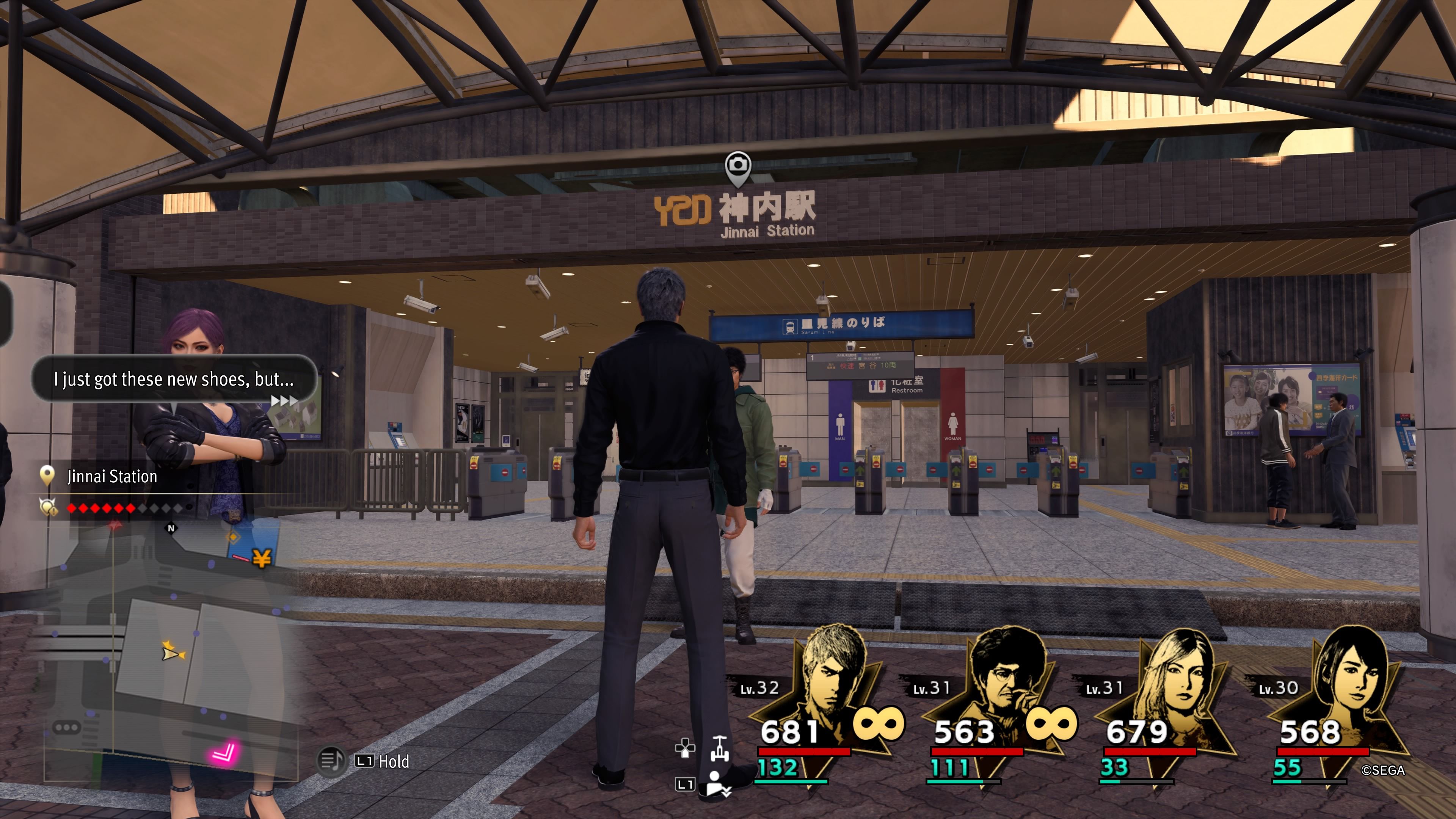 Kiryu and Seonhee standing in front of the entrance to the West Jinnai Station in Like A Dragon: Infinite Wealth.