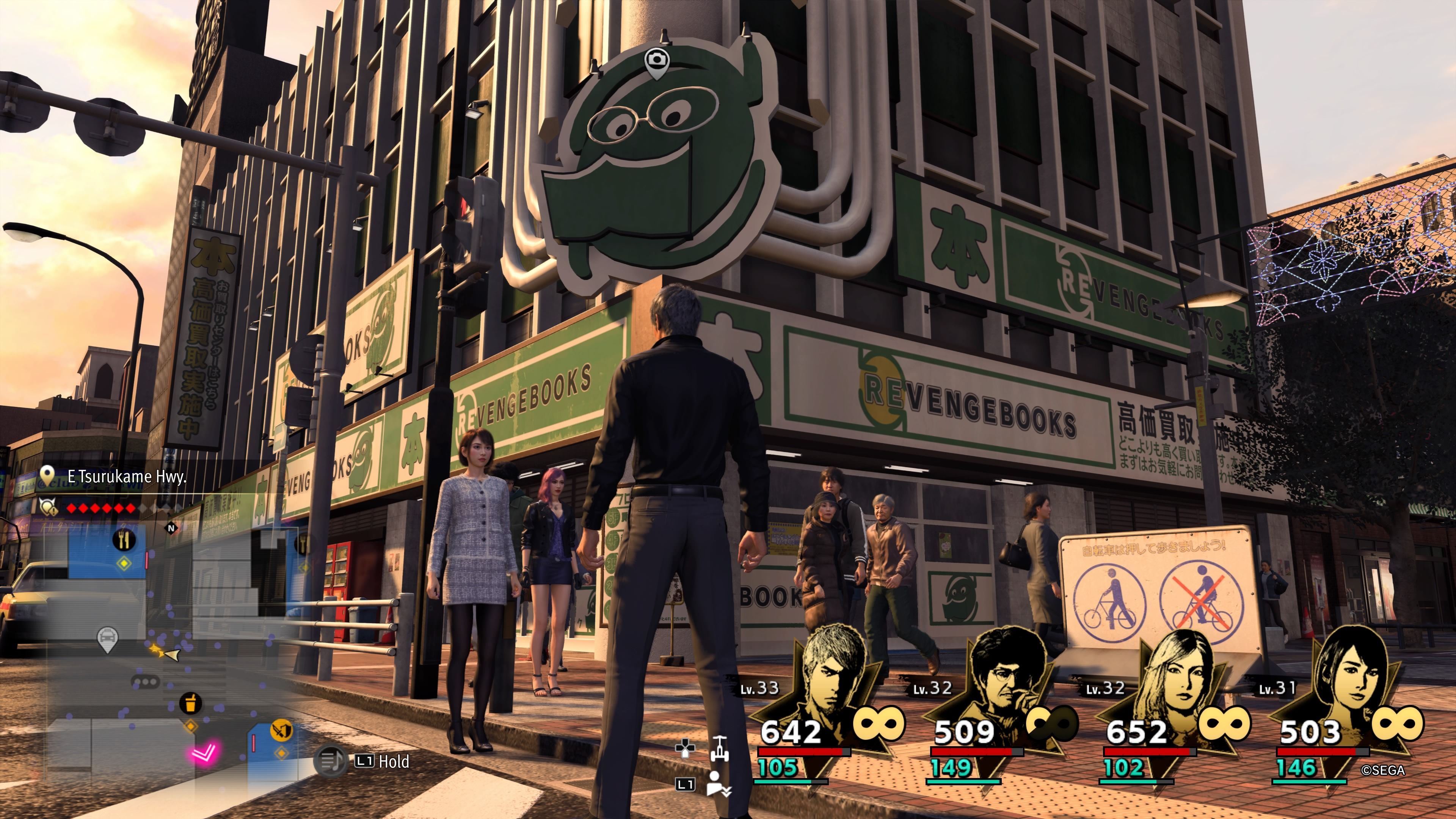 Kiryu standing beneath the Revenger Bookstore in downtown Yokohama in Like A Dragon: Infinite Wealth.