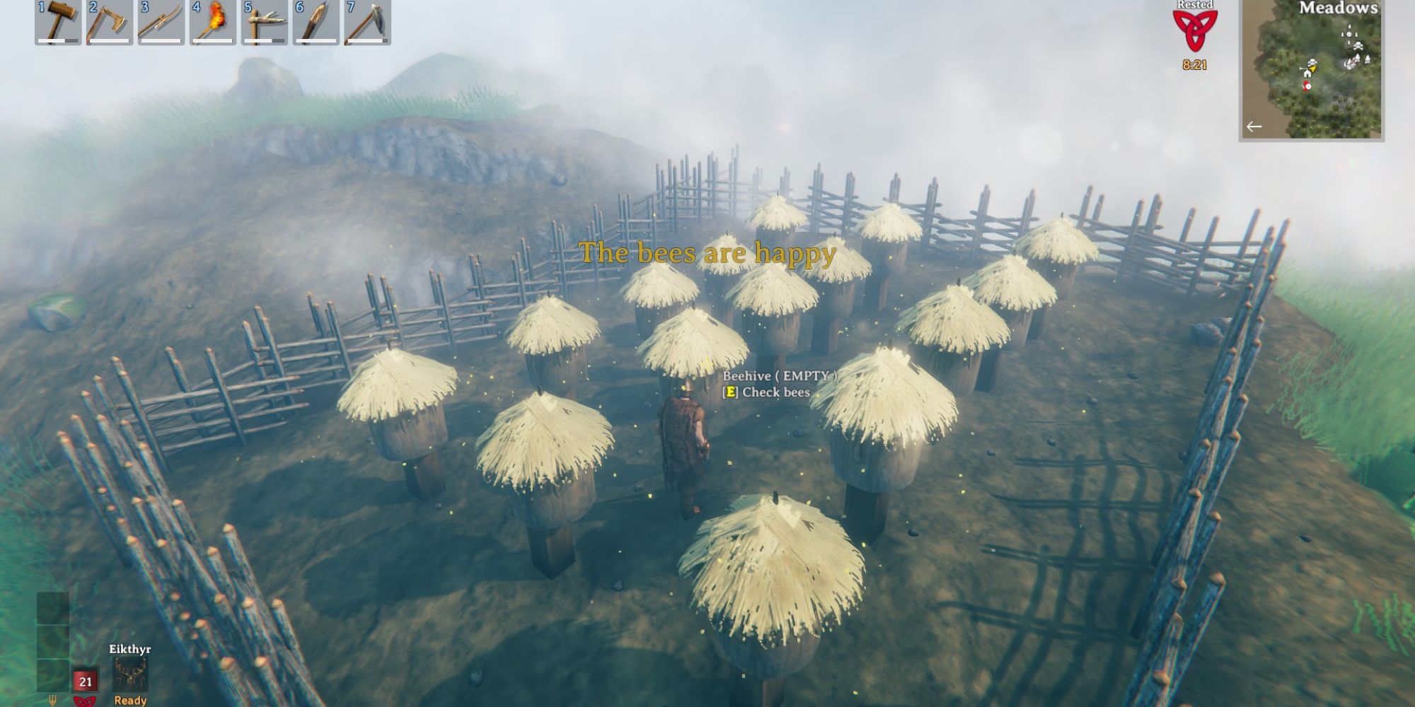 Player checking on bee farm, with the bees being happy