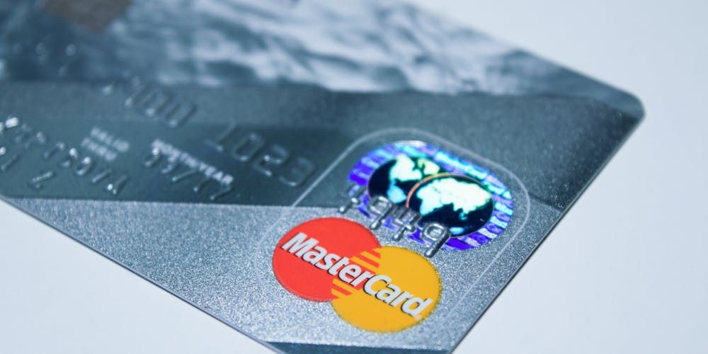 Silver-Gray MasterCard With Ocean On Half The Card
