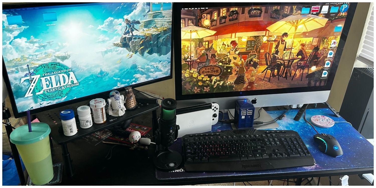 A dual-monitor setup where the left monitor has been raised above the other to maximize desk space.