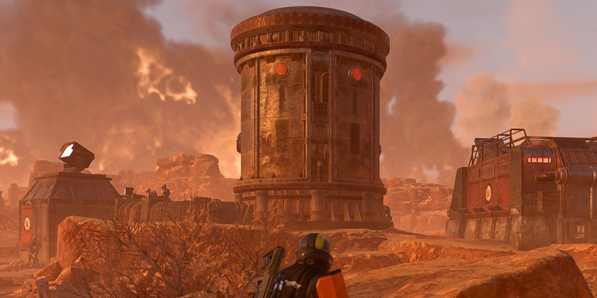 Player character in orange armor approaching a large Fuel Silo on the planet Durgen in Helldivers 2.